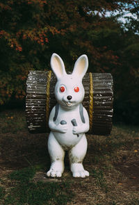 Close-up of animal sculpture on field