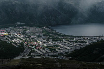 High angle view of townscape by sea
