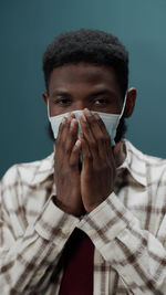 Portrait of young man wearing mask