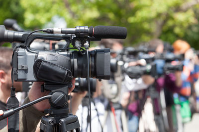 Close-up of person with video camera