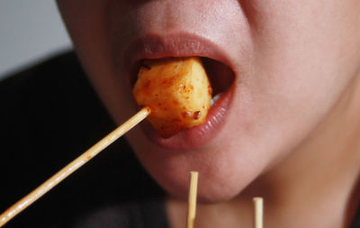 Close-up of woman eating food