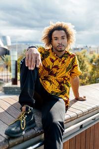 Portrait of man sitting outdoors