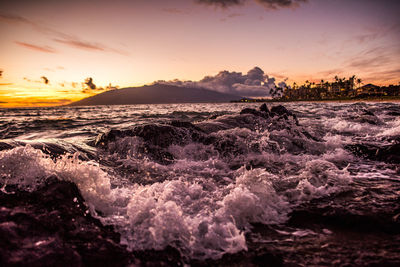 Scenic view of sea against cloudy sky