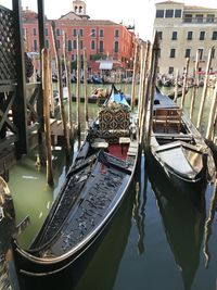 Boats moored at harbor