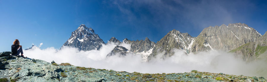 Panoramic view of snowcapped mountains against sky