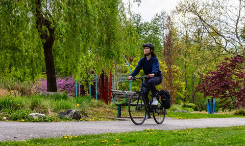 Man riding bicycle on road