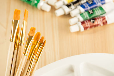 High angle view of paintbrushes on table