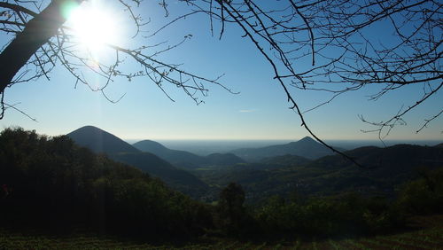 Scenic view of silhouette mountains against sky at sunset