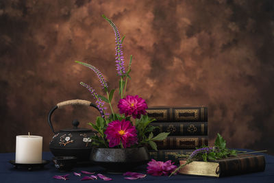 Close-up of purple flower pot on table