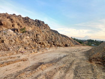 Scenic view of arid landscape against sky