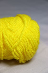 Close-up of yellow leaf on table