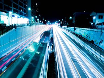 High angle view of light trails on road at night