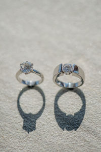 High angle view of wedding rings on table