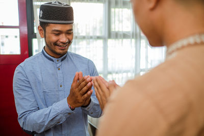 Cropped image of man using mobile phone