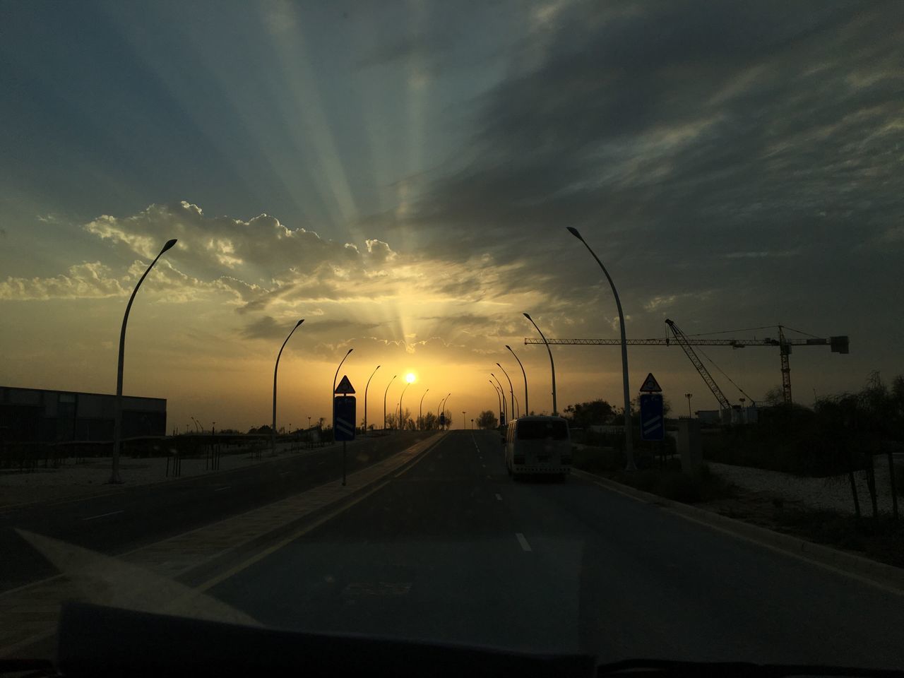 sunset, sky, road, cloud - sky, transportation, car, dramatic sky, no people, the way forward, sunbeam, city, nature, outdoors, illuminated, tree, sun, day