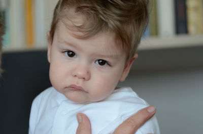 Close-up portrait of cute baby at home