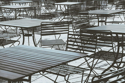 Empty chairs and tables in restaurant