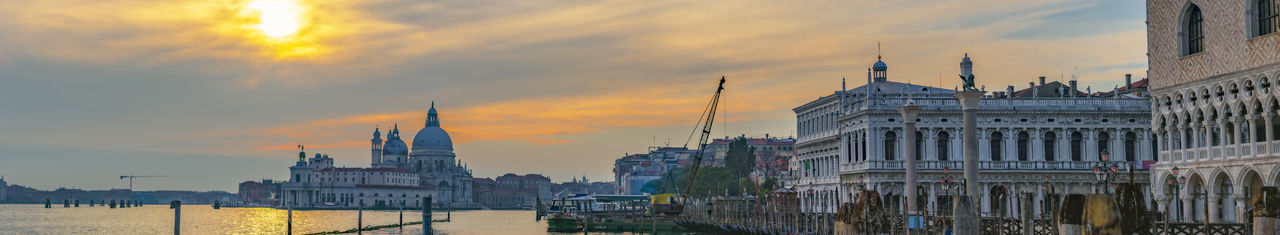 Panoramic view of buildings against sky during sunset
