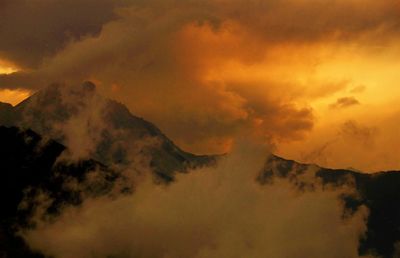 Low angle view of dramatic sky during sunset