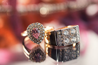 Close-up of wedding rings on table