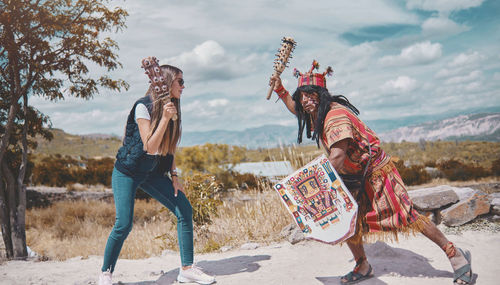 Representation of inca warrior dressed and with battle, prehispanic fighting with a tourist in peru