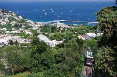 High angle view of buildings and sea in city
