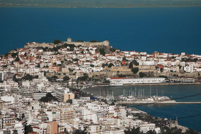 High angle view of town scape of kavala greece by sea against sky