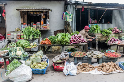 Man selling vegetables in market 