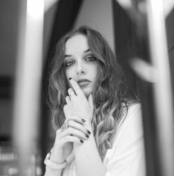 Low angle portrait of young woman at home