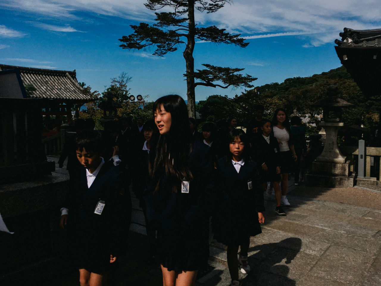 tree, outdoors, sky, real people, building exterior, smiling, young adult, architecture, young women, day