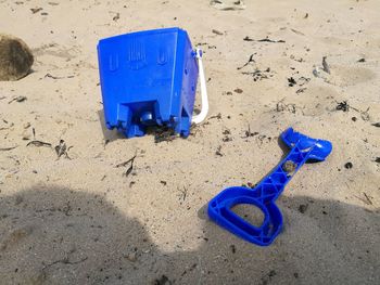 Blue container on beach