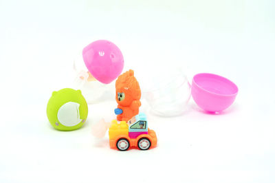 Close-up of toys over white background