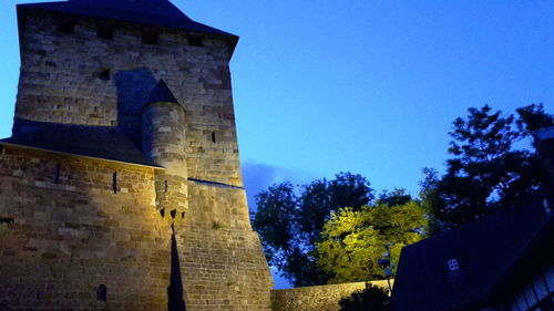 Low angle view of built structure against blue sky