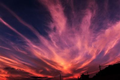 Low angle view of dramatic sky during sunset