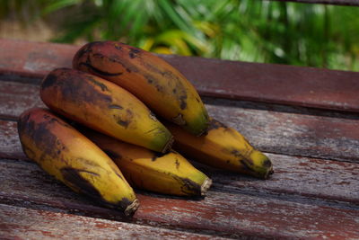 Close-up of bananas on wood