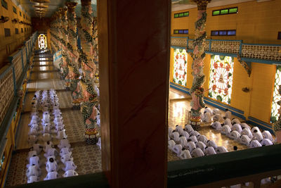 Statue amidst buildings seen through window