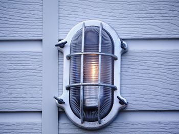 Close-up of electric lamp on wall