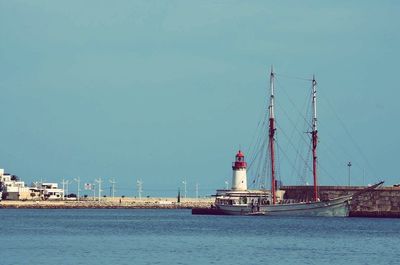 View of built structure by sea