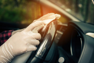 Close-up of hand holding car