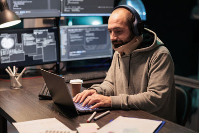 Portrait of young man working at office