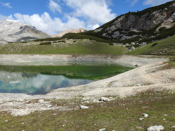 Scenic view of lake and mountains against sky