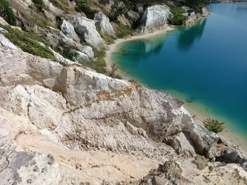 High angle view of rocks by sea