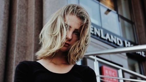 Portrait of young woman looking down