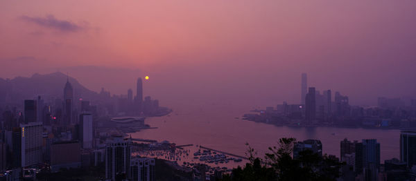 High angle view of buildings against sky at sunset