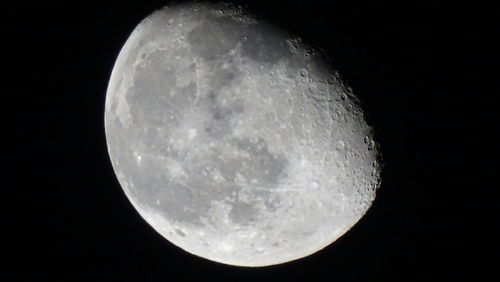 Low angle view of moon against clear sky at night