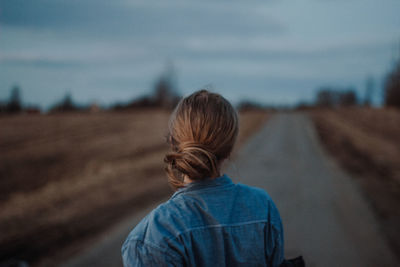 Rear view of woman looking at landscape