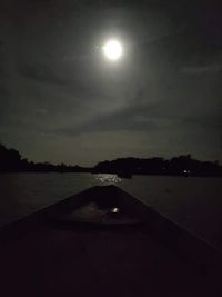 Scenic view of lake against sky at night