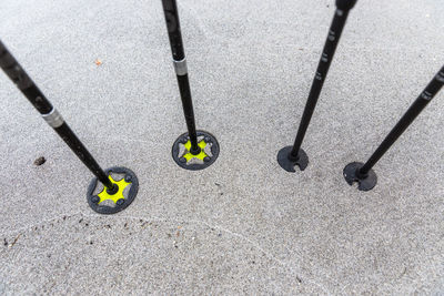 High angle view of hiking poles on road