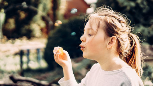 Portrait of woman holding outdoors
