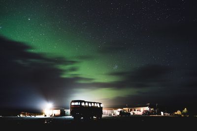 Illuminated building against sky at night